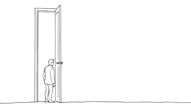 A person standing at an open door, looking in
